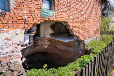 Sinkholes can weaken foundations and damage buildings.